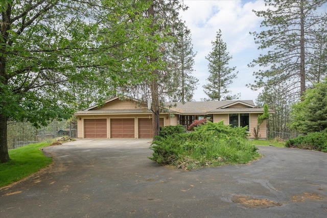 16905 N Mockingbird Ct, Nine Mile Falls, WA 99026 - single story home with asphalt driveway and a garage