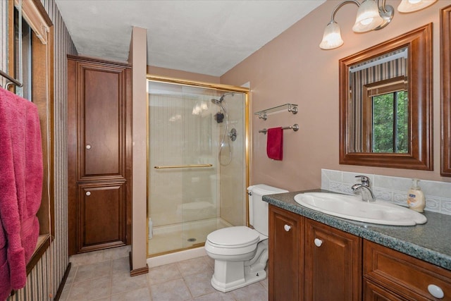 16905 N Mockingbird Ct, Nine Mile Falls, WA 99026 - full bath featuring toilet, vanity, a shower stall, and tile patterned floors