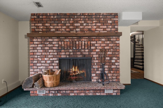 16905 N Mockingbird Ct, Nine Mile Falls, WA 99026 - detailed view of carpet floors, a fireplace, a textured ceiling, and baseboards