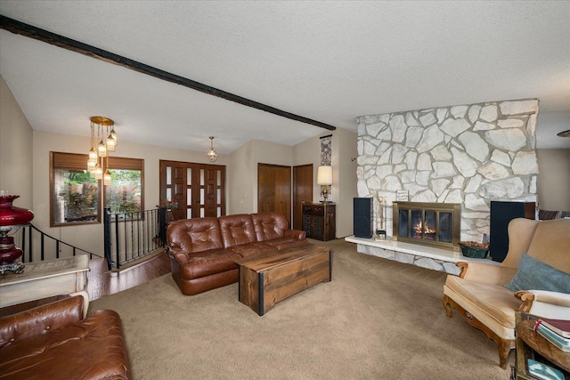 16905 N Mockingbird Ct, Nine Mile Falls, WA 99026 - living area featuring carpet, a fireplace, and a textured ceiling