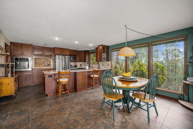 16905 N Mockingbird Ct, Nine Mile Falls, WA 99026 - dining space featuring recessed lighting