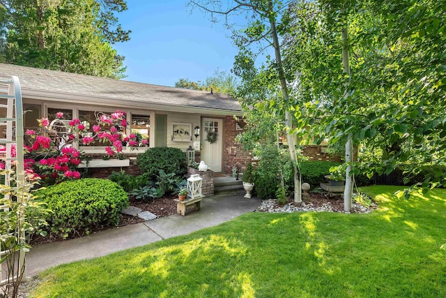 2825 W Woodside Ave, Spokane, WA 99208 - view of front of home featuring brick siding and a front lawn