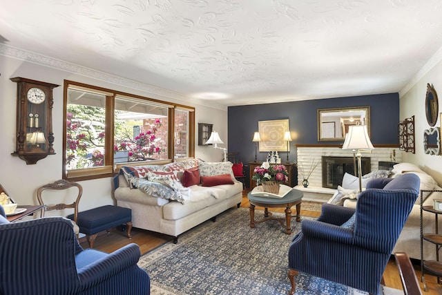 2825 W Woodside Ave, Spokane, WA 99208 - living room featuring wood finished floors, a fireplace, and crown molding