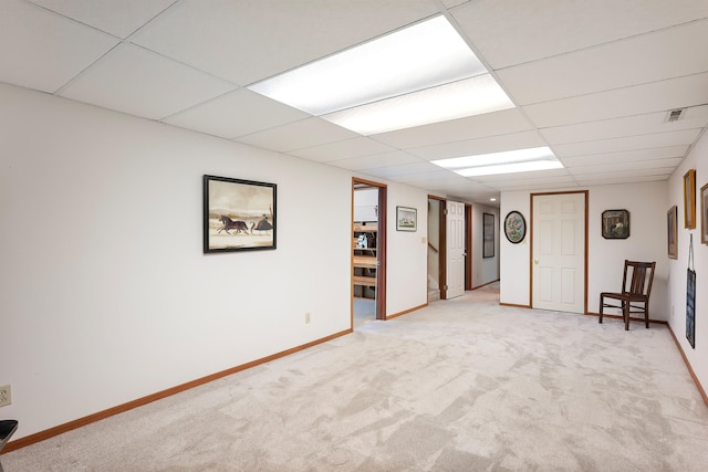 2825 W Woodside Ave, Spokane, WA 99208 - finished below grade area featuring light colored carpet, baseboards, and a paneled ceiling