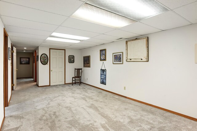 2825 W Woodside Ave, Spokane, WA 99208 - below grade area with a paneled ceiling, light carpet, and baseboards
