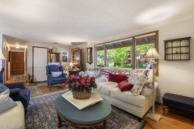 2825 W Woodside Ave, Spokane, WA 99208 - living area featuring wood finished floors and ornamental molding