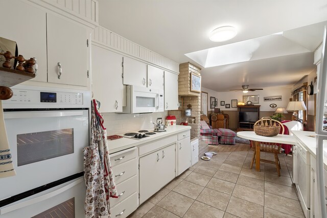 2825 W Woodside Ave, Spokane, WA 99208 - kitchen with white appliances, tasteful backsplash, light tile patterned flooring, open floor plan, and light countertops