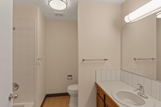 221 E Rockwood Blvd Unit 12, Spokane, WA 99202 - full bathroom featuring toilet, vanity, wood finished floors, and shower / bathtub combination