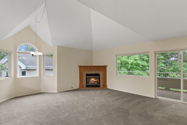 221 E Rockwood Blvd Unit 12, Spokane, WA 99202 - unfurnished living room with carpet, high vaulted ceiling, a chandelier, baseboards, and a tiled fireplace