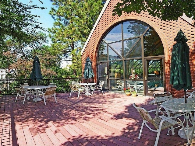 221 E Rockwood Blvd Unit 12, Spokane, WA 99202 - wooden deck featuring outdoor dining area