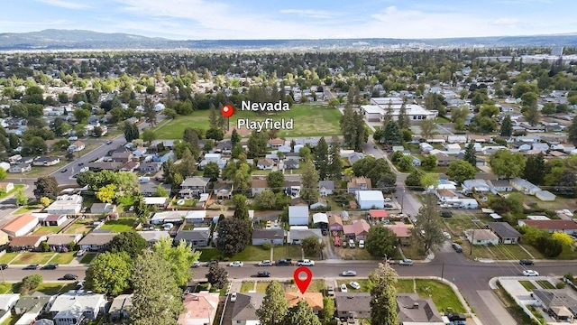 811 E Dalke Ave, Spokane, WA 99208 - aerial overview of property's location with nearby suburban area and a mountainous background