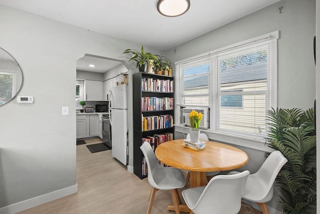 811 E Dalke Ave, Spokane, WA 99208 - dining room featuring light wood-type flooring and baseboards