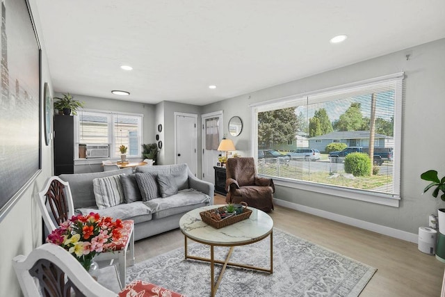 811 E Dalke Ave, Spokane, WA 99208 - living room featuring wood finished floors, recessed lighting, baseboards, and cooling unit