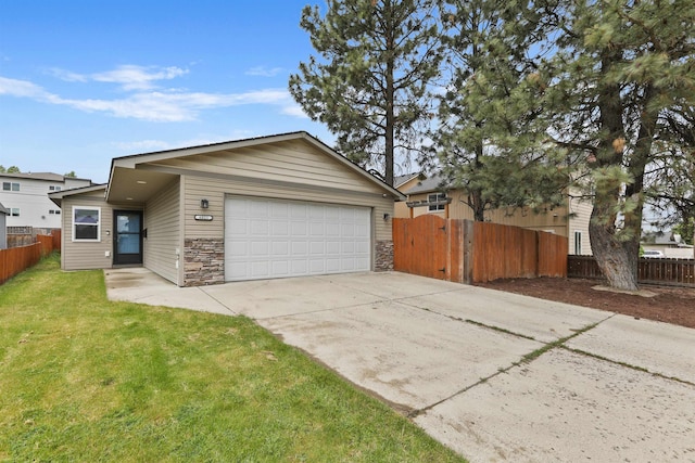 6021 N Addison St, Spokane, WA 99208 - view of front of house with stone siding, concrete driveway, and an attached garage