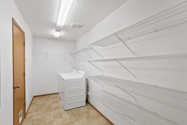 6021 N Addison St, Spokane, WA 99208 - walk in closet with washer and dryer and stone finish floors