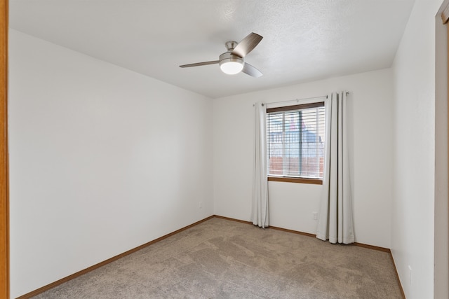 6021 N Addison St, Spokane, WA 99208 - empty room featuring carpet floors, ceiling fan, and baseboards