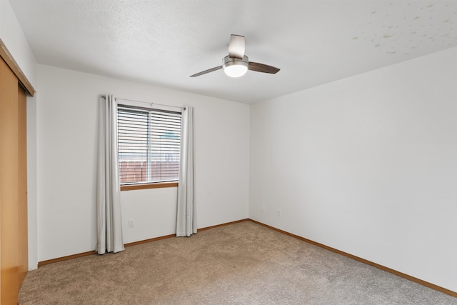 6021 N Addison St, Spokane, WA 99208 - unfurnished bedroom with light carpet, a closet, baseboards, and ceiling fan