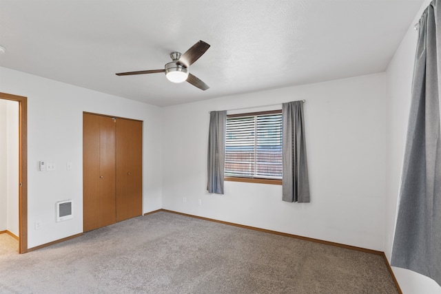 6021 N Addison St, Spokane, WA 99208 - unfurnished bedroom with heating unit, carpet, a closet, and baseboards