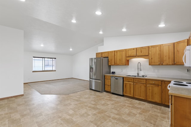 6021 N Addison St, Spokane, WA 99208 - kitchen with appliances with stainless steel finishes, a sink, lofted ceiling, light countertops, and baseboards