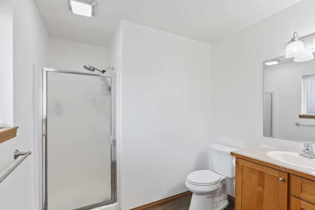 6021 N Addison St, Spokane, WA 99208 - full bath with a shower stall, vanity, toilet, and wood finished floors
