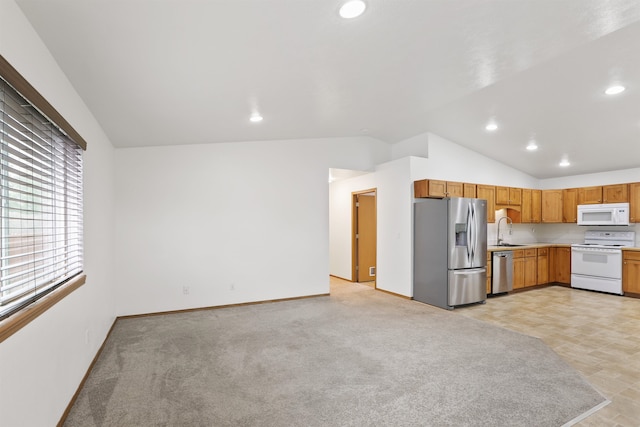 6021 N Addison St, Spokane, WA 99208 - kitchen featuring stainless steel appliances, a sink, lofted ceiling, light countertops, and recessed lighting