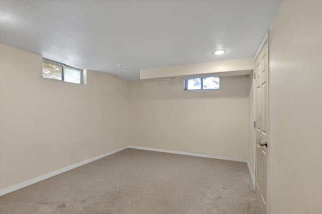 9715 E Nora Ave, Spokane Valley, WA 99206 - basement featuring light carpet, baseboards, recessed lighting, and a textured ceiling