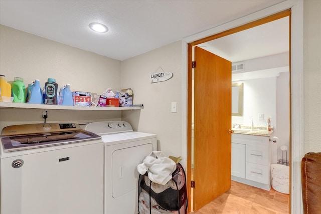 9715 E Nora Ave, Spokane Valley, WA 99206 - laundry room with washer and dryer and light tile patterned flooring