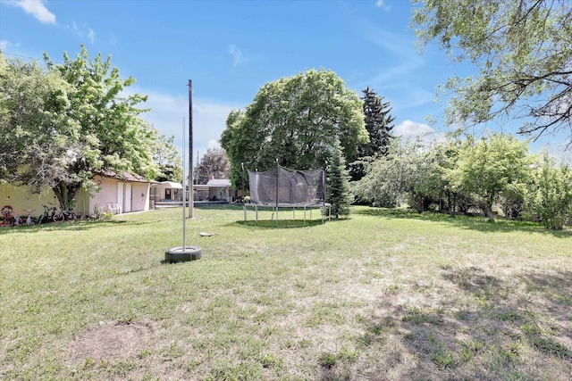 9715 E Nora Ave, Spokane Valley, WA 99206 - view of green lawn featuring a trampoline