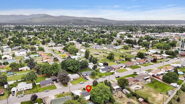 9715 E Nora Ave, Spokane Valley, WA 99206 - aerial view of property and surrounding area featuring mountains and nearby suburban area