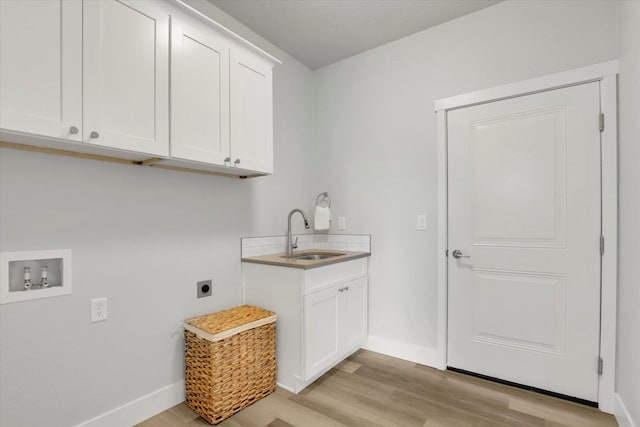 1109 N Country Club Dr Unit 20, Deer Park, WA 99006 - laundry room featuring cabinet space, hookup for an electric dryer, light wood-style floors, and baseboards