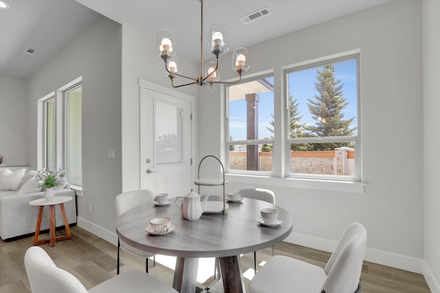 1109 N Country Club Dr Unit 20, Deer Park, WA 99006 - dining area with wood finished floors, baseboards, and a chandelier