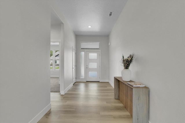 1109 N Country Club Dr Unit 20, Deer Park, WA 99006 - foyer entrance with baseboards, light wood finished floors, a textured ceiling, and recessed lighting