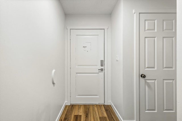 917 E Indiana Ave, Spokane, WA 99207 - entryway with dark wood finished floors and baseboards