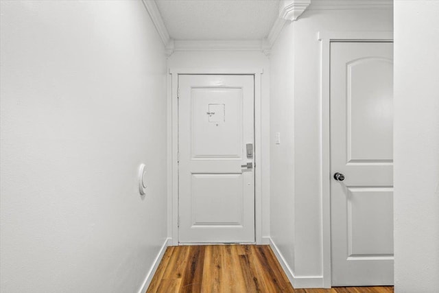 917 E Indiana Ave, Spokane, WA 99207 - doorway to outside featuring ornamental molding, wood finished floors, and baseboards