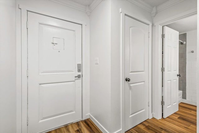 917 E Indiana Ave, Spokane, WA 99207 - doorway with crown molding, dark wood finished floors, and baseboards