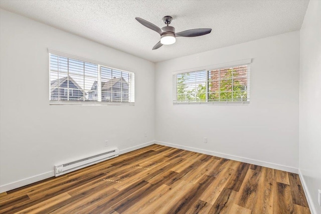 917 E Indiana Ave, Spokane, WA 99207 - spare room with a baseboard heating unit, wood finished floors, baseboards, a textured ceiling, and ceiling fan