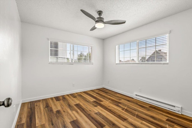 917 E Indiana Ave, Spokane, WA 99207 - unfurnished room with a baseboard radiator, wood finished floors, a ceiling fan, baseboards, and a textured ceiling