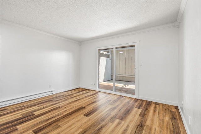 917 E Indiana Ave, Spokane, WA 99207 - empty room with wood finished floors, a textured ceiling, a baseboard heating unit, ornamental molding, and baseboards