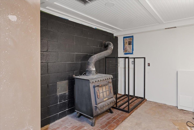 3720 E Bridges Rd, Elk, WA 99009 - detailed view of a wood stove, concrete block wall, and concrete floors