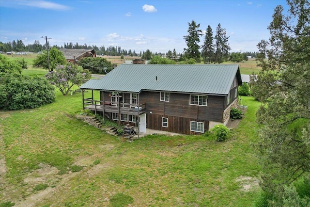 3720 E Bridges Rd, Elk, WA 99009 - back of property with metal roof, a deck, and a lawn