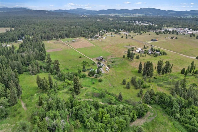 3720 E Bridges Rd, Elk, WA 99009 - aerial view of property's location featuring a mountainous background and a heavily wooded area