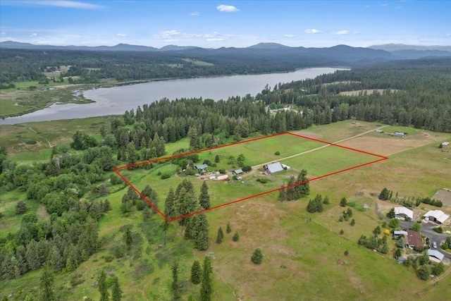 3720 E Bridges Rd, Elk, WA 99009 - aerial view of property's location featuring a water and mountain view, a forest, and property boundaries highlighted