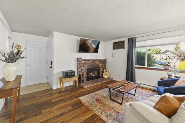 112 E Weile Ave Unit # 1, Spokane, WA 99208 - living area with a baseboard radiator, wood finished floors, a textured ceiling, a brick fireplace, and a wall unit AC