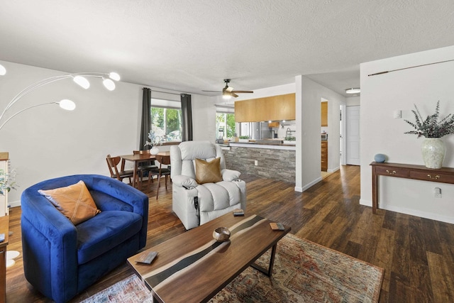 112 E Weile Ave Unit # 1, Spokane, WA 99208 - living area with a ceiling fan, wood finished floors, a textured ceiling, and baseboards