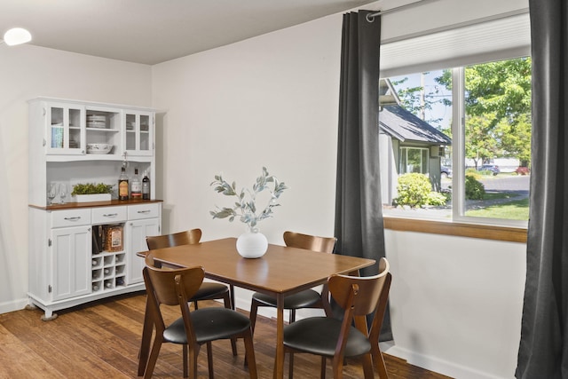 112 E Weile Ave Unit # 1, Spokane, WA 99208 - dining space featuring a dry bar and wood finished floors