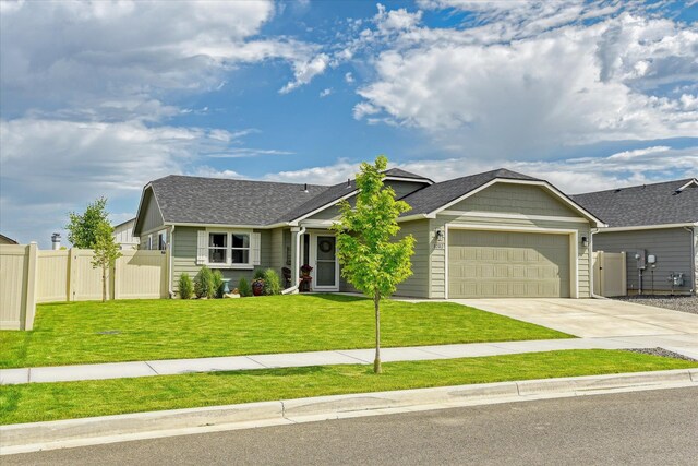 8202 W Quaking Rd, Spokane, WA 99224 - view of front facade featuring an attached garage, driveway, and roof with shingles