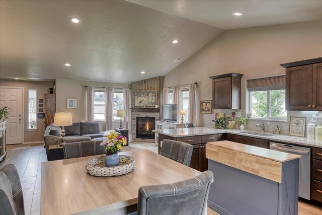 8202 W Quaking Rd, Spokane, WA 99224 - dining space with recessed lighting, a fireplace, and high vaulted ceiling