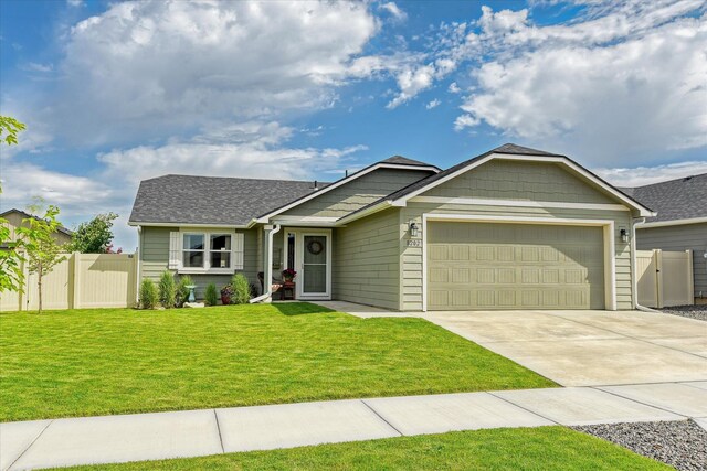 8202 W Quaking Rd, Spokane, WA 99224 - ranch-style house with an attached garage, driveway, and a shingled roof