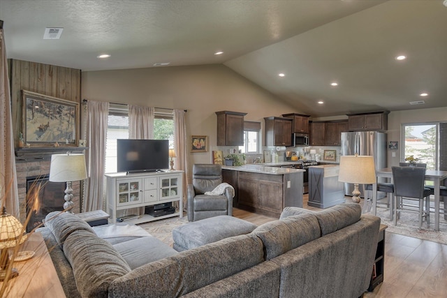 8202 W Quaking Rd, Spokane, WA 99224 - living room featuring light wood-style flooring, recessed lighting, and high vaulted ceiling