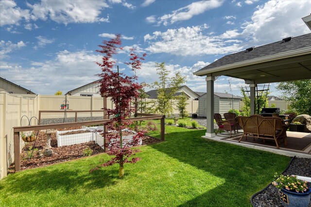 8202 W Quaking Rd, Spokane, WA 99224 - view of yard with a patio area and a garden